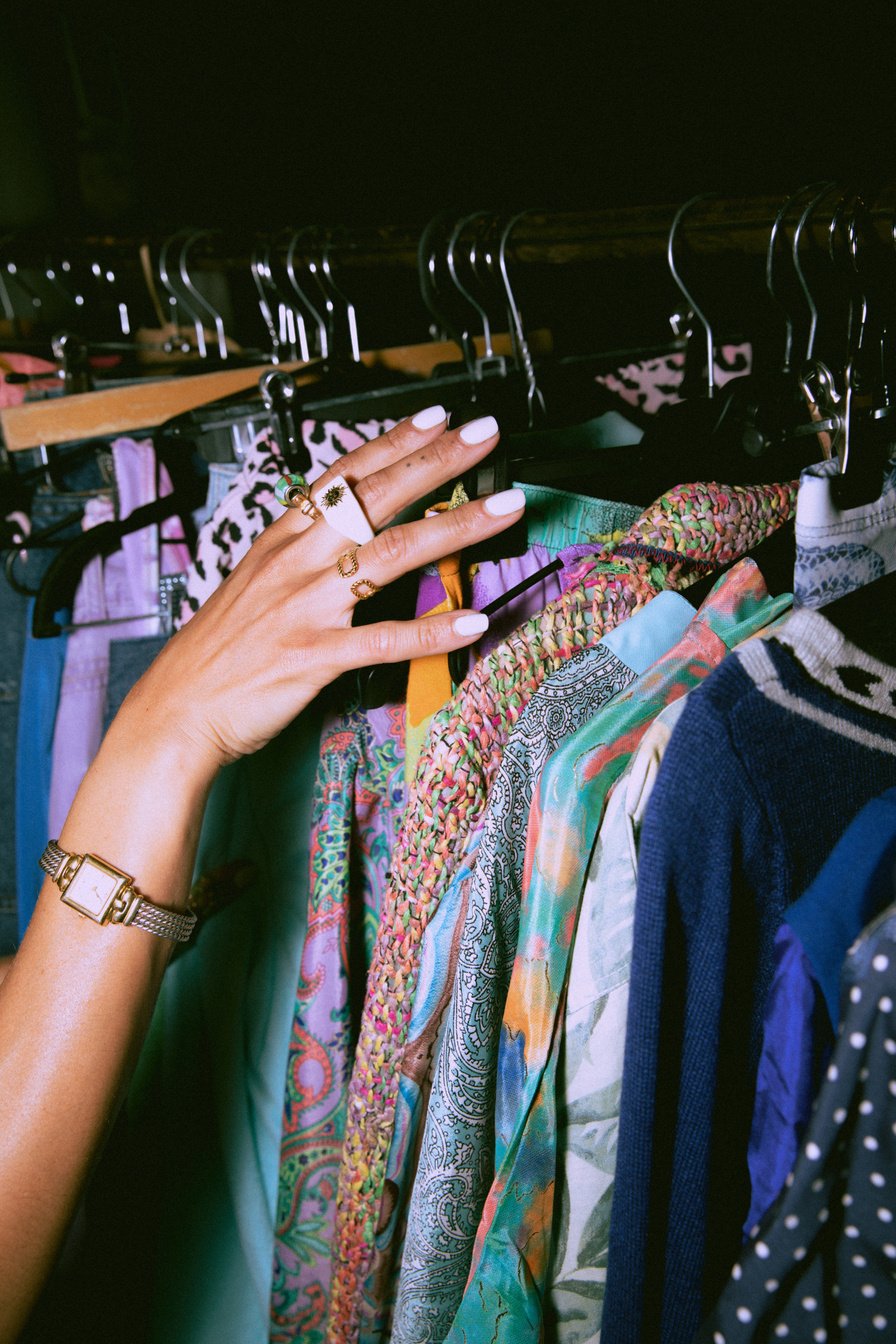 Woman Shopping Clothes in a Thrift Shop